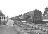 British Railways Standard 9F 2-10-0 No 92204 heads an up Class F unfitted freight on 13th March 1965