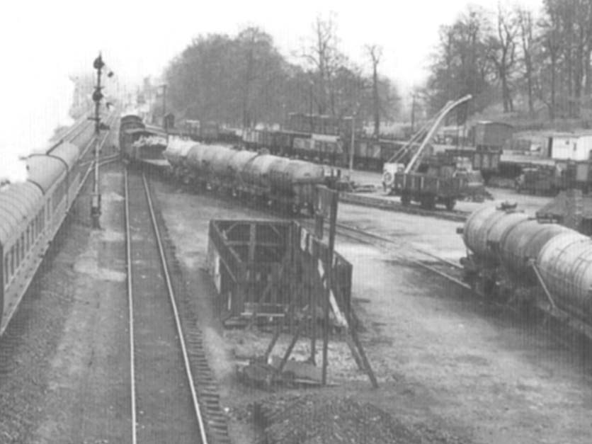 Close up showing a train of four-wheel petrol tank cars being marshalled for the Regent Oil Company