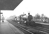 GWR 2-8-0 28xx class No 2872 pulls slowly out of the up refuge siding with a Group 10 classified freight train