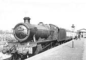 Ex-GWR 4-6-0 Hall class No 6933 'Bintles Hall' stands at the head of a down express train bound for Snow Hill