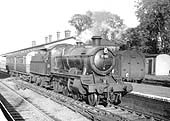 Ex-GWR 2-6-0 43xx class Mogul No 7301 passes through the station on a down one-coach railcar trailer service in June 1951