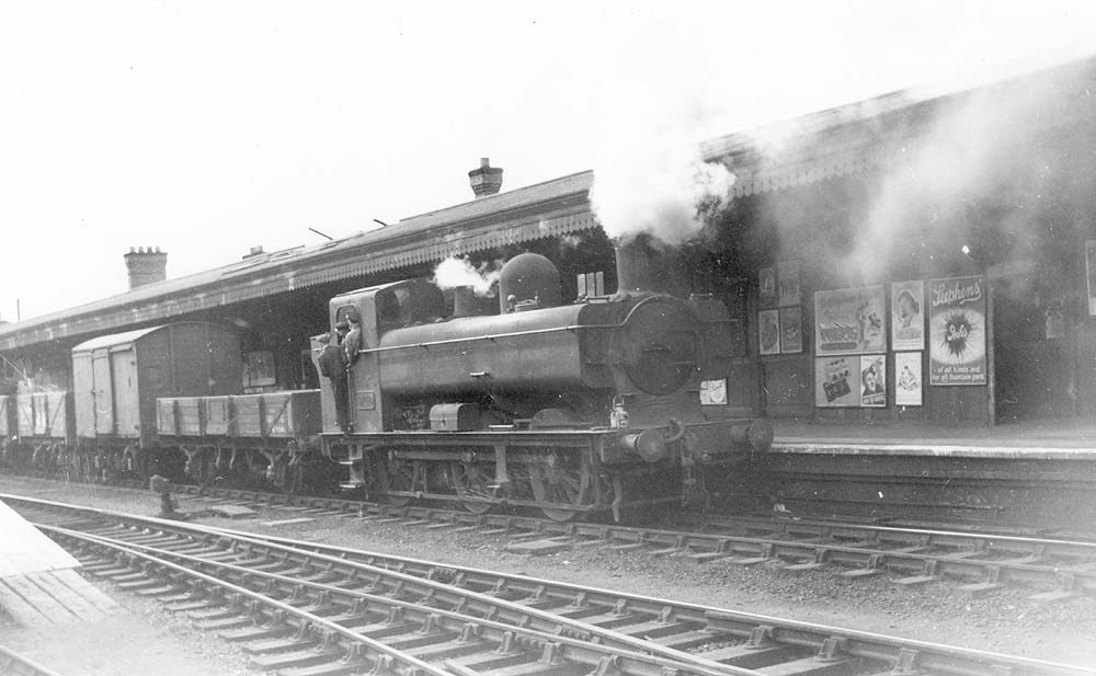 Ex-GWR 0-6-0PT 55xx class Pannier Tank No 9740 is seen shunting wagons in to the goods yard from the mainline between paths