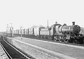 Ex-GWR 2-6-0 Mogul No 5313 ghosts pass Warwick station at the head of an up semi-fitted express goods train