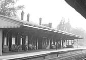Close up showing the down platform and main building with the entrance in the centre and a telephone box on the right