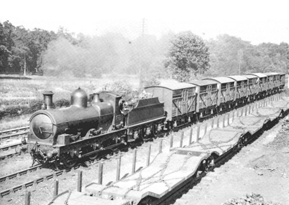 An unidentified GWR 0-6-0 'Armstrong Goods' is seen at the head of a short down cattle train most probably en-route to Bordesley Junction cattle wharf