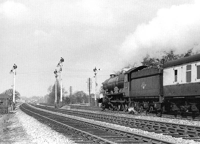 Ex-GWR 4-6-0 No 6018 'King Henry VI' is seen heading a Paddington to Snow Hill excursion working on 15th March 1959