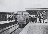 An unidentified GWR 0-6-0PT locomotive stands at the up platform during celebrations marking the opening of the station