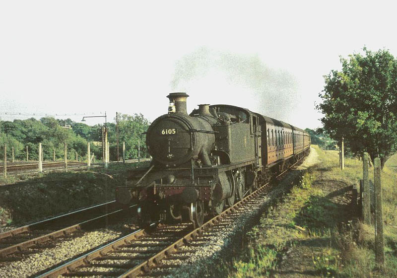 Ex-Great Western Railway 61XX class 2-6-2T large prairie No 6105 arriving at a rural Widney Manor station