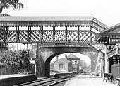 Close up showing the original 1860 station platform and building plus Wilmcote Signal Box seen through the archway the bridge carrying Station Road over the railway