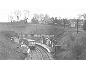 Looking south from Wood End Lane road bridge showing the booking office on the top of the embankment