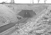 An elevated view of the tunnel from the footpath on the embankment showing the sharp curve of the tunnel bore