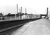 Looking towards Stratford upon Avon circa 1960 showing the fencing on the left marking the footpath to the down platform circa 1960s