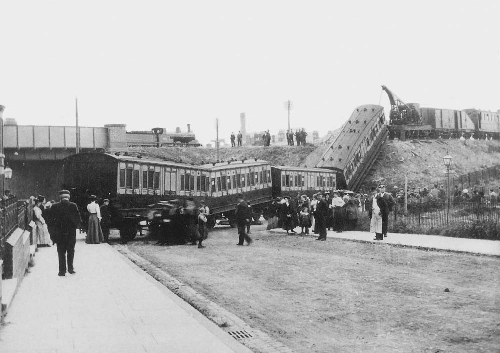 Looking down Broomfield Road showing the fourth coach being prepared for removal by the installation of temporary road placed underneath