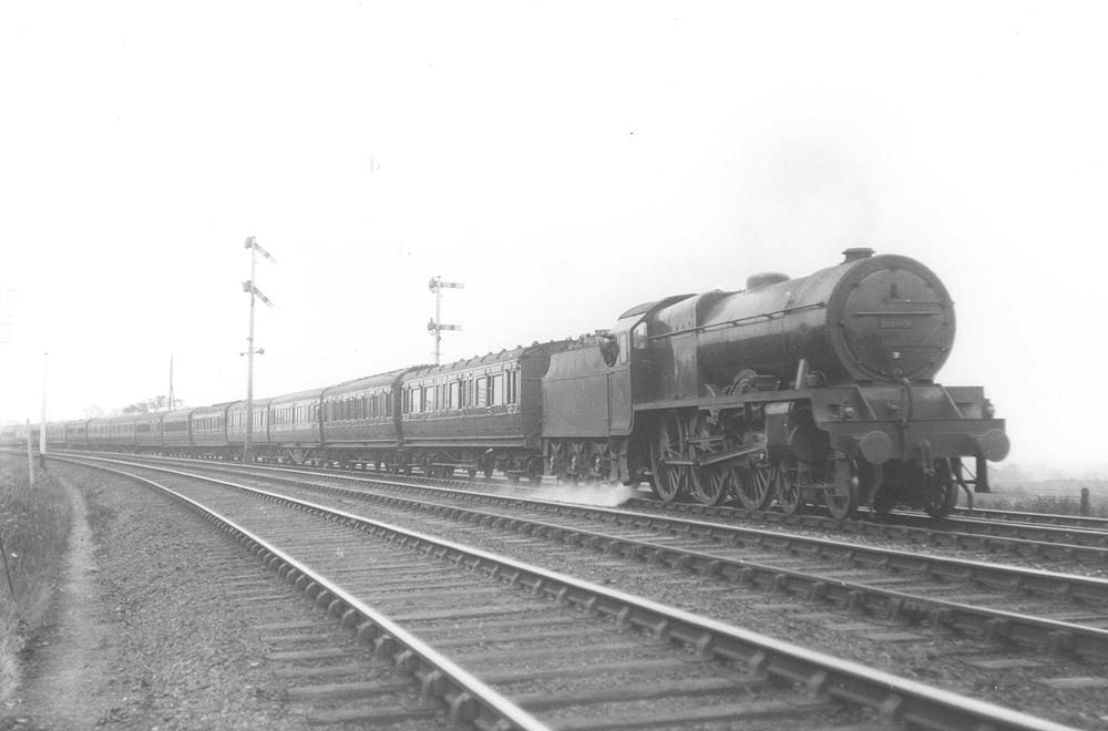 LMS 4-6-0 Royal Scot class No 6109 'Royal Engineer' is seen at the head of the fourteen coach up Manxman near Atherstone in May 1928
