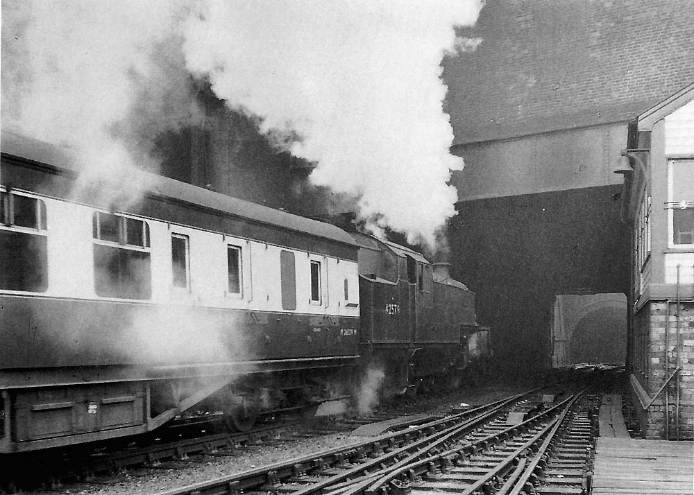 Ex-LMS 4MT 2-6-4T No 42579 is seen alongside New Street No 1 Signal Cabin as it enters Worcester Street tunnel on an up working