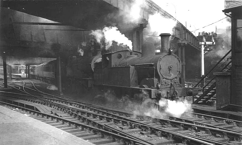 Ex-LNWR 2F 0-6-2T 'Watford Tank' No 6924 is seen passing under Hill Street bridge whilst double-heading an unidentified ex-LMS 4P 4-4-0 Compound
