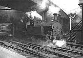 Ex-LNWR 2F 0-6-2T 'Watford Tank' No 6924 is seen passing under Hill Street bridge whilst double-heading an unidentified ex-LMS 4P 4-4-0 Compound