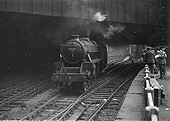 Ex-LMS 5MT 4-6-0 No 45322 is seen running light engine as it passes under Queens Drive bridge and the former LNWR Parcels Office