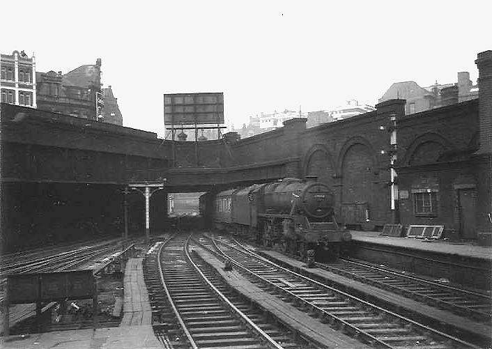 Ex-LMS 5MT 4-6-0 No 44843 is seen arriving at Platform 7 as it passes under the bridge carrying the Hill Street and Queens Drive junction