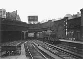 Ex-LMS 5MT 4-6-0 No 44843 is seen arriving at Platform 7 as it passes under the bridge carrying the Hill Street and Queens Drive junction