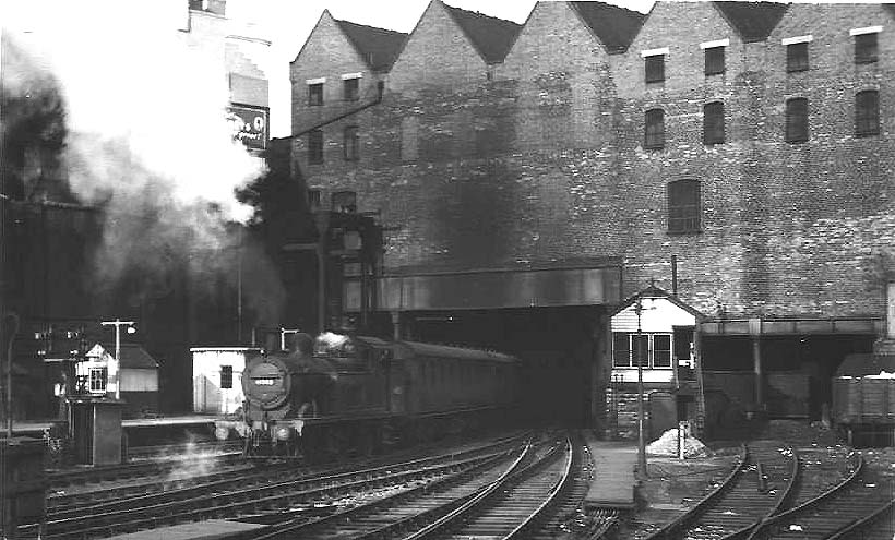 Ex-LMS 2P 0-4-4T No 41902 is seen emerging from Worcester Road tunnel alongside Signal Box 1 at the head of a local train