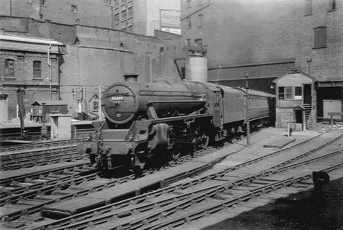 Ex-LMS 5MT 4-6-0 No 45419 is seen passing Signal Box No 2 as it arrives at Platform 6 on a down express service from Rugby