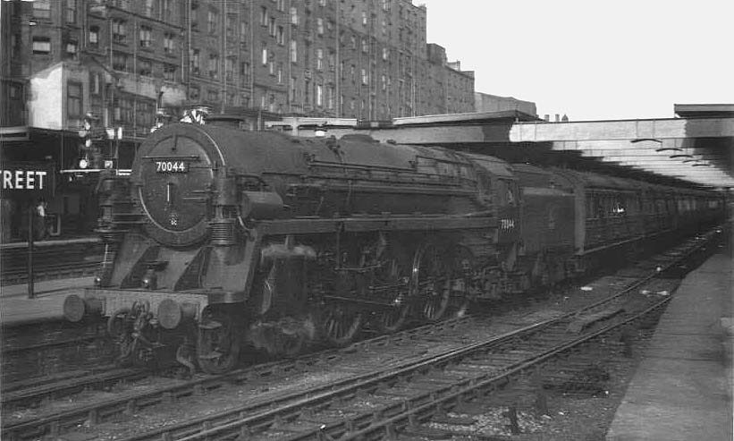 British Railways Class 7 4-6-2 No 70044 'Earl Haig' is seen standing at the West end of Platform 5 with a down passenger service