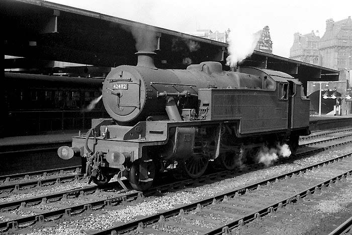 Ex-LMS 4MT 2-6-4T No 42482 is seen standing on the down middle road between Platforms 3 and 4 whilst acting as station pilot