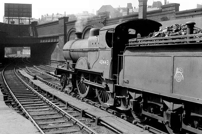 Ex-Midland Railway 2P 4-4-0 No 40443 is seen standing  on the middle road between Platforms 7 and 8 at the West end of New Street