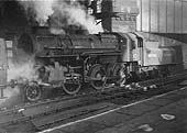 Ex-LMS 4MT 2-6-0 No M3010, an 'Ivatt Mogul', is seen departing the East end of Platform 7 with an empty stock working