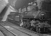 Built by Horwich Works in November 1949, Ivatt 4MT 2-6-0 No 43049 is wearing a Saltley shedplate in this view of it in New Street Station