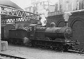 Ex-Midland Railway 3F 0-6-0 No 43523 is seen working in Fish Sidings with the Midland Carriage siding behind circa 1954