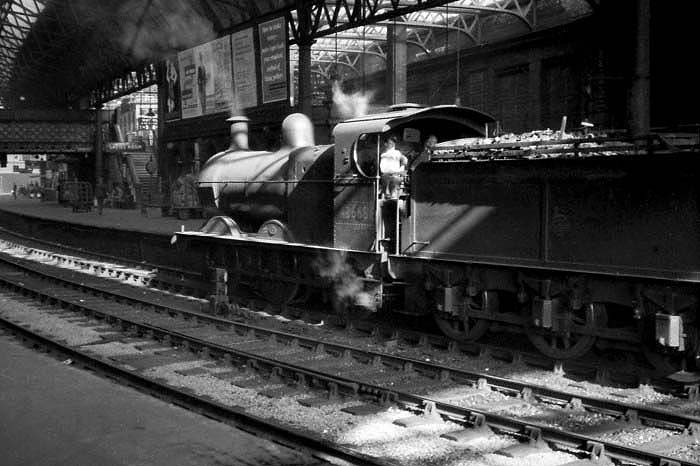 Ex-Midland Railway 3F 0-6-0 No 43668 is seen running tender first through Platform 7 whilst working within the station as Pilot