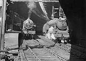 Ex-LMS 4-4-0 Compound No 40932 and 4-6-0 Jubilee class No 45599 are standing at Platforms 7 and 8 adjacent to Queens Drive bridge