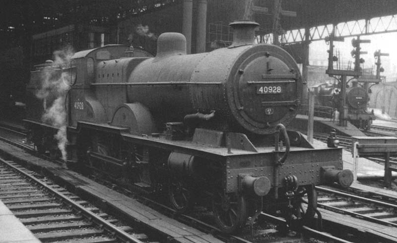 Ex-LMS 4P 4-4-0 Compound No 40928 stands light engine on the middle road between Platforms 7 and 8 at the West end of the station