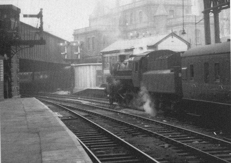 British Railways Standard Class 4 4-6-0 No 76087 is seen standing at the East end of Platform 8 at the head of a local service to Worcester