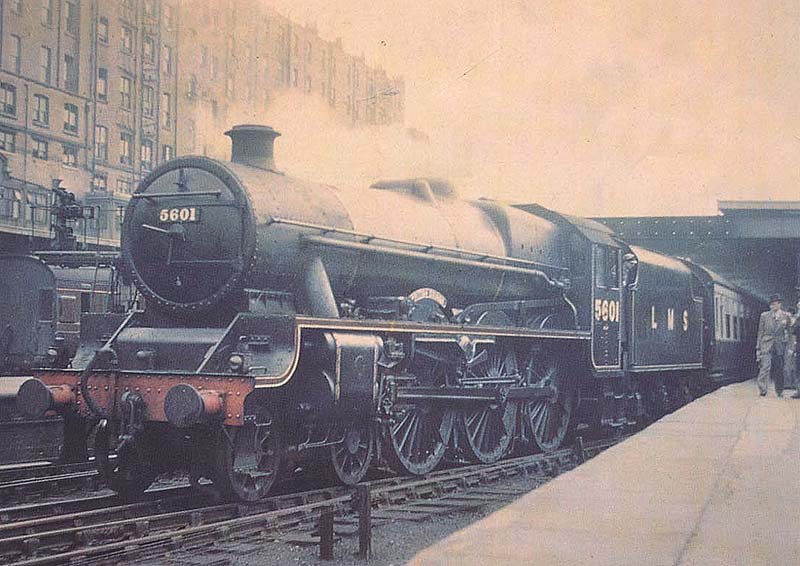 Ex-LMS 5XP 4-6-0 Jubilee class No 5601 'British Guiana' is still wearing LMS Black lined livery at the head of a train of Carmine and Cream coaching stock