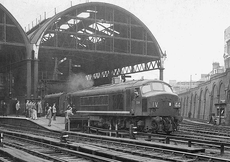 British Railways Type 4 1-Co-Co1 D94 is seen standing at Platform 9 ready to depart with the 12:52pm York to Bristol express on 8th June 1961