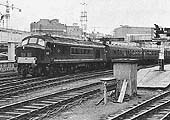 British Railways Type 4 1Co-Co1 D42 is seen departing Platform 4 at 3 31pm on a Cardiff to the North East express service on Sunday 12th September 1965