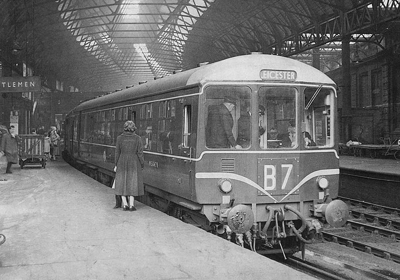A 3 Car Birmingham Railway Carriage & Wagon Company Diesel Multiple Unit set stands at Platform 8 on the 6:15pm New Street to Leicester service