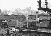 Ex-LNER 4-6-0 'B1' No 61325 and ex-LMS 5P4F 2-6-0 'Crab' No 2758 are seen from Platform 10 at the West End of New Street station during April 1949