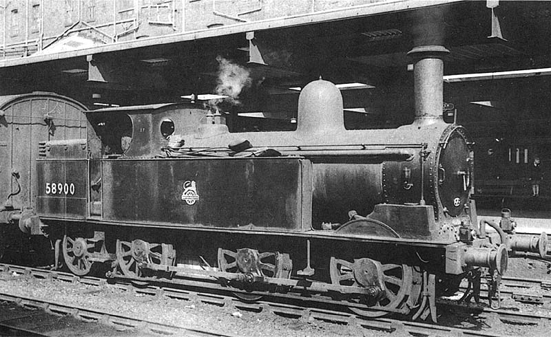 Ex-LNWR 2F 0-6-2T No 58900 is on pilot duties when its seen on the up middle road between Platforms 3 and 4 shunting stock on 25th August 1953