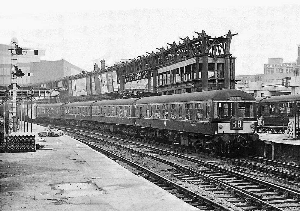 A Craven Three-Car DMU is seen standing empty at the West end of Platform 8 alongside the remains of No 4 Signal Cabin on 24th October 1964