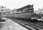 A Craven Three-Car DMU is seen standing empty at the West end of Platform 8 alongside the remains of Signal Box No 4 on 24th October 1964
