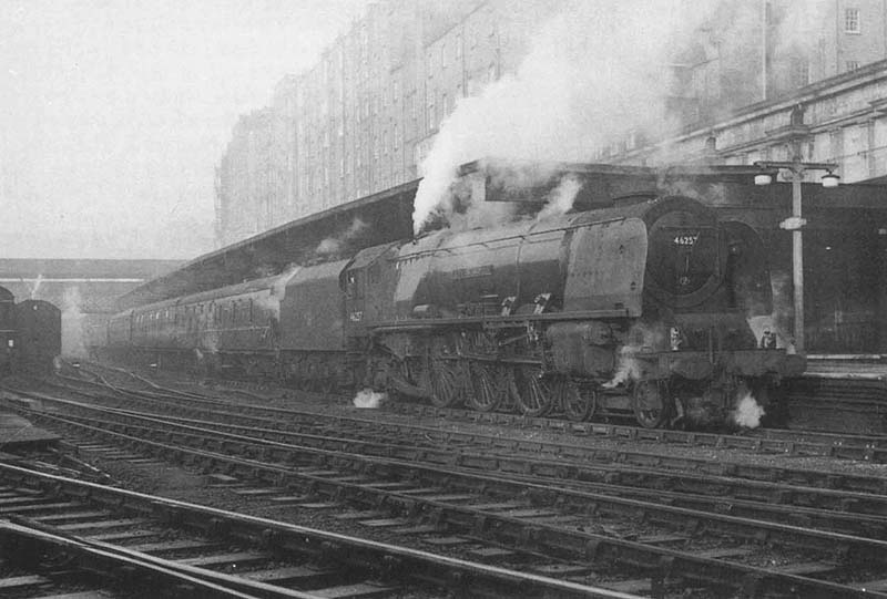 Ex-LMS 7P 4-6-0 Princess Coronation class No 46257 'City of Salford' is seen standing at the East end of Platform 1 with an up express