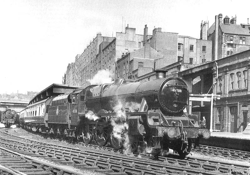 Ex-LMS 5XP Jubilee Class 4-6-0 No 45738 'Samson' stands ready to depart with an up express service to Euston on 9th July 1954