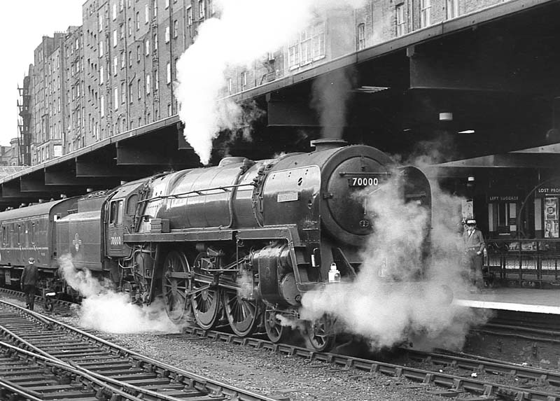 British Railways Standard Class 7MT 4-6-2 No 70000 'Britannia' stands at platform 3 on an up express on 22nd June 1963