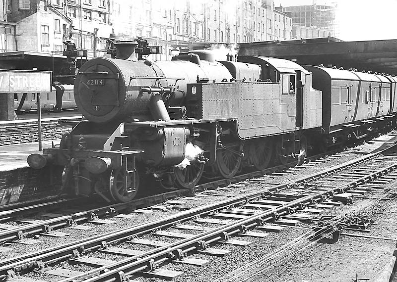 British Railways built 4MT 2-6-4T No 42112 is seen standing at the head of a down express on 22nd June 1963