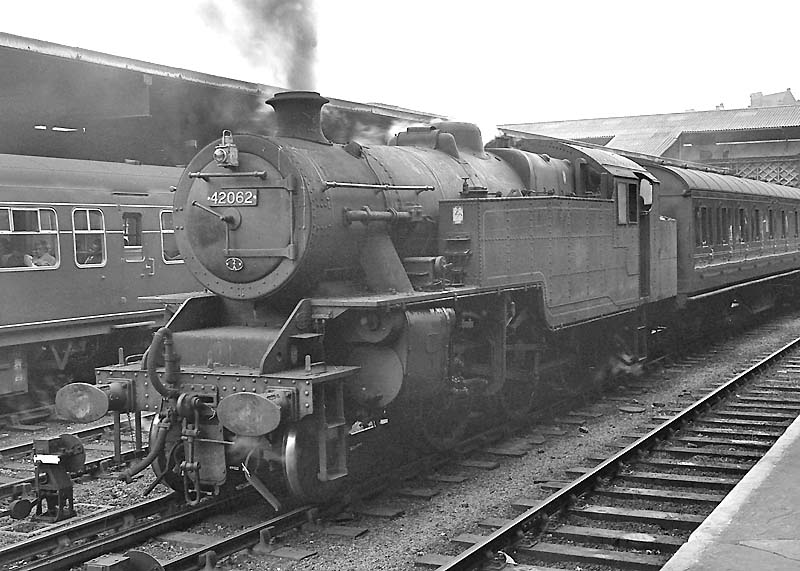 British Railways built 4P 2-6-4T No 42062 stands on the middle  road with empty coaching stock on 14th September 1962