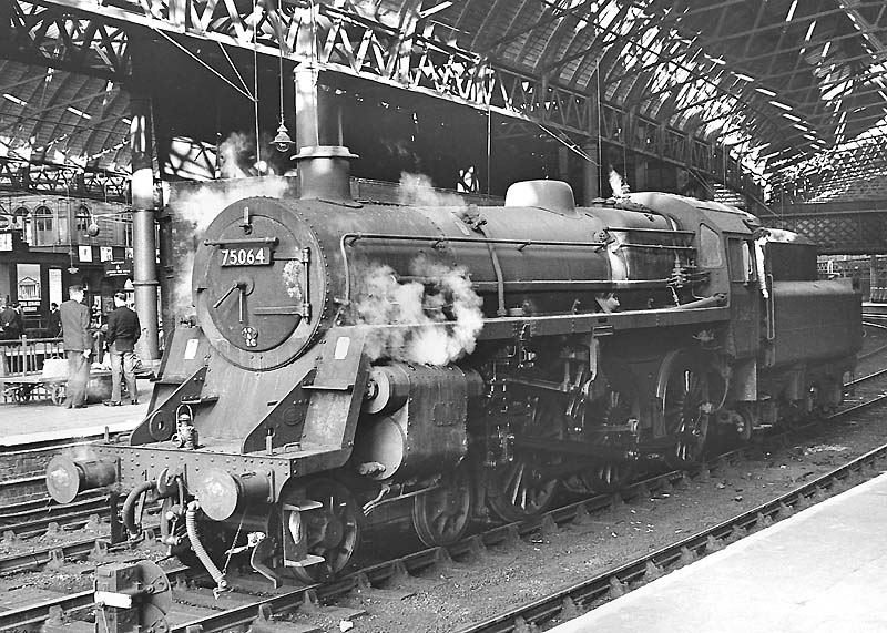 British Railways Standard Class 7MT 4-6-2 No 70031 'Byron' is about to depart platform 3 with an up express on 20th April 1955